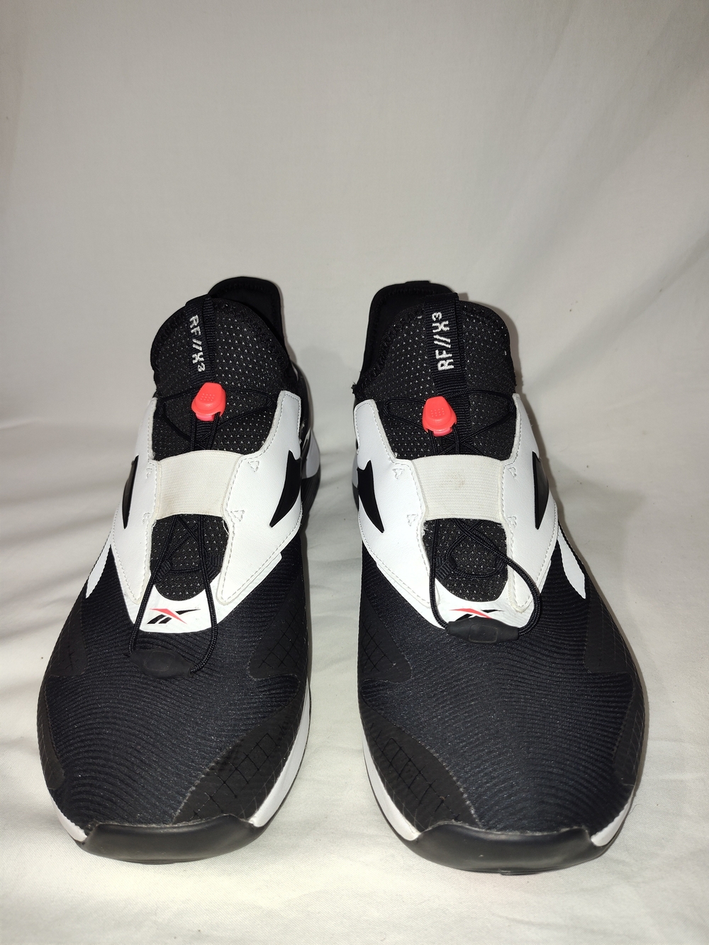 Reebok Men’s Black and White Athletic Slip-On Sneakers